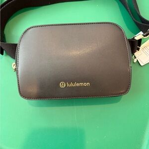 lululemon athletica Black Crossbody Bag with gold hardware